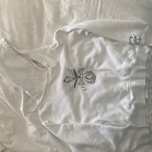 Size S. White with snoopy on Front and right arm.